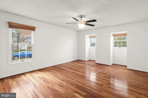 a view of balcony with wooden floor and fence