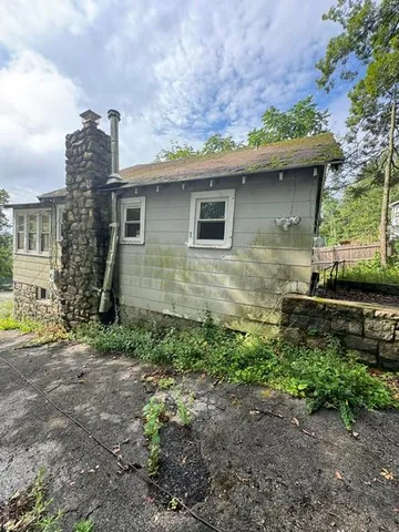 a backyard of a house with lots of green space