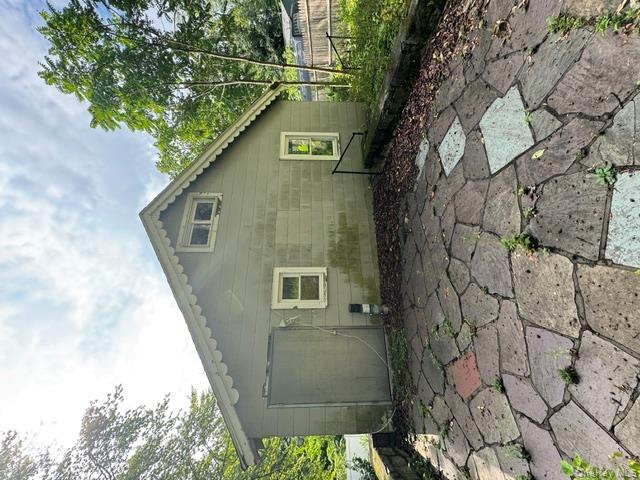 157 Tanglewylde Road Lake Peekskill, NY 10537 - Photo 4 of 13 a backyard of a house with lots of green space