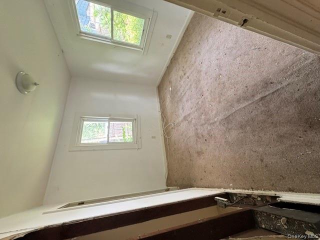 157 Tanglewylde Road Lake Peekskill, NY 10537 - Photo 10 of 13 an empty room with windows