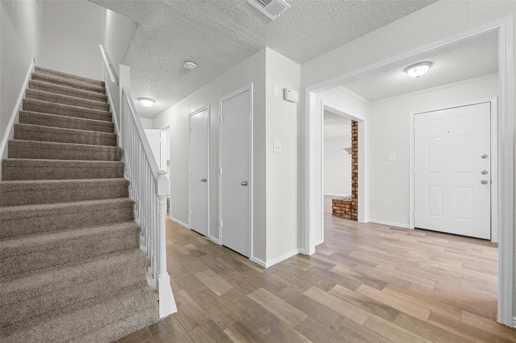7501 Kings Ridge Road Frisco, TX 75035 - Photo 13 of 27 a view of an entryway with staircase