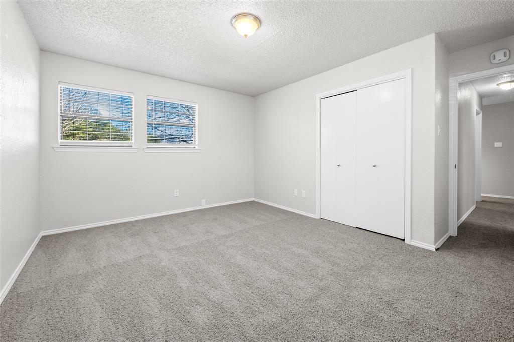 7501 Kings Ridge Road Frisco, TX 75035 - Photo 19 of 27 an empty room with windows