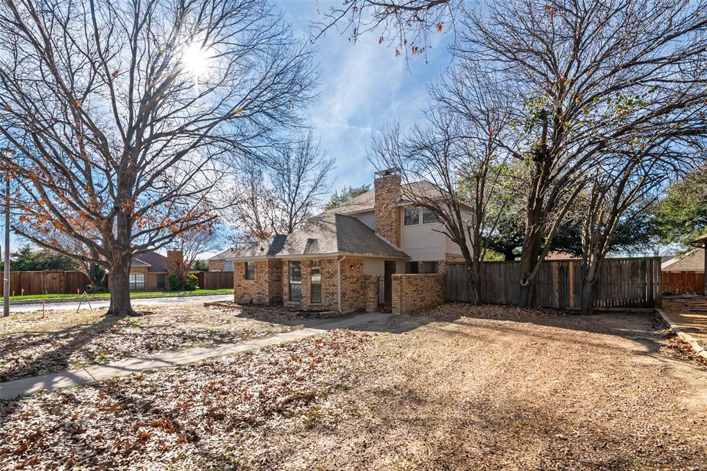 7501 Kings Ridge Road Frisco, TX 75035 - Photo 2 of 27 a view of a house with a yard covered in snow