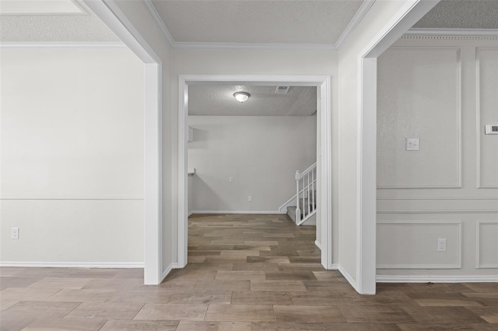 7501 Kings Ridge Road Frisco, TX 75035 - Photo 5 of 27 an empty room with wooden door