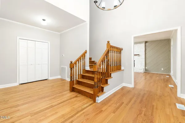 a view of staircase with wooden floor