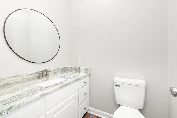 a bedroom with a bed and a stove top oven