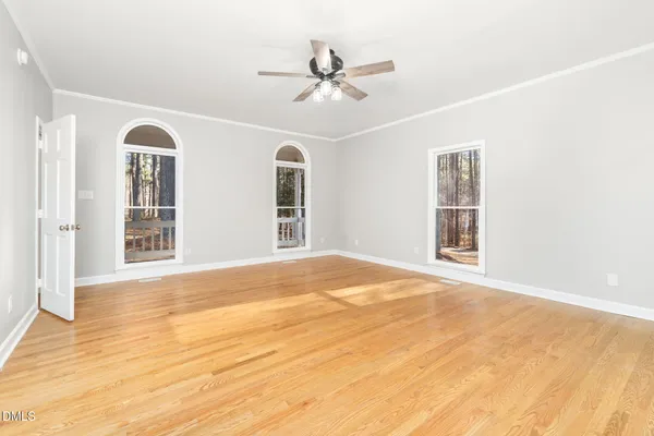 a view of a room with wooden floor and cabinet