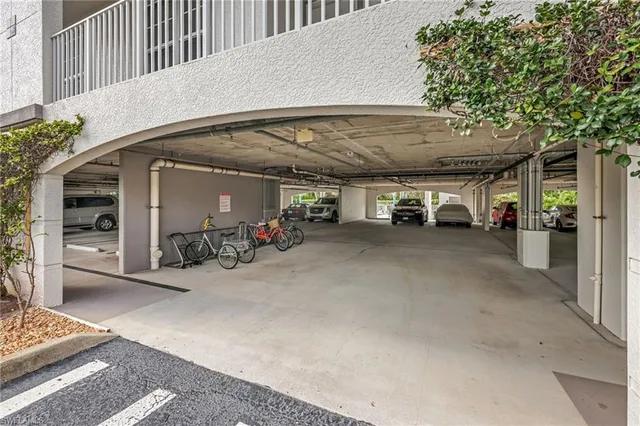 a view of parking garage with cars