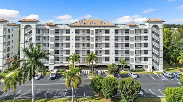 an aerial view of residential building and lake