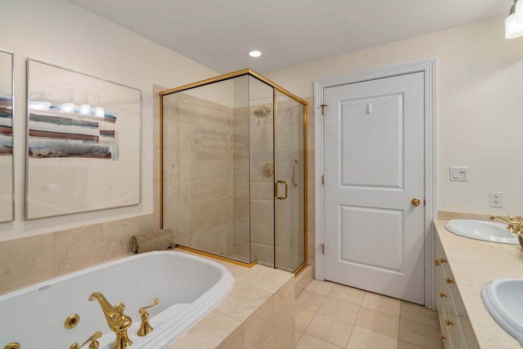 630 Hammond Street, Unit 102 Brookline, MA 02467 - Photo 15 of 19 a bathroom with a tub a sink and a shower