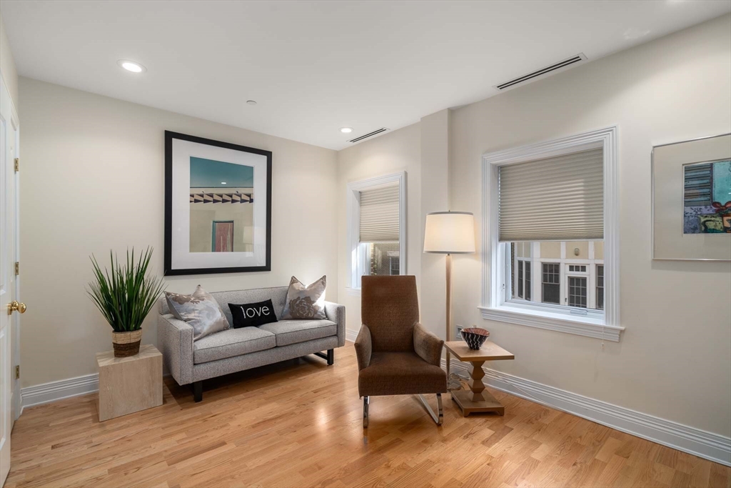630 Hammond Street, Unit 102 Brookline, MA 02467 - Photo 16 of 19 a living room with furniture and a window