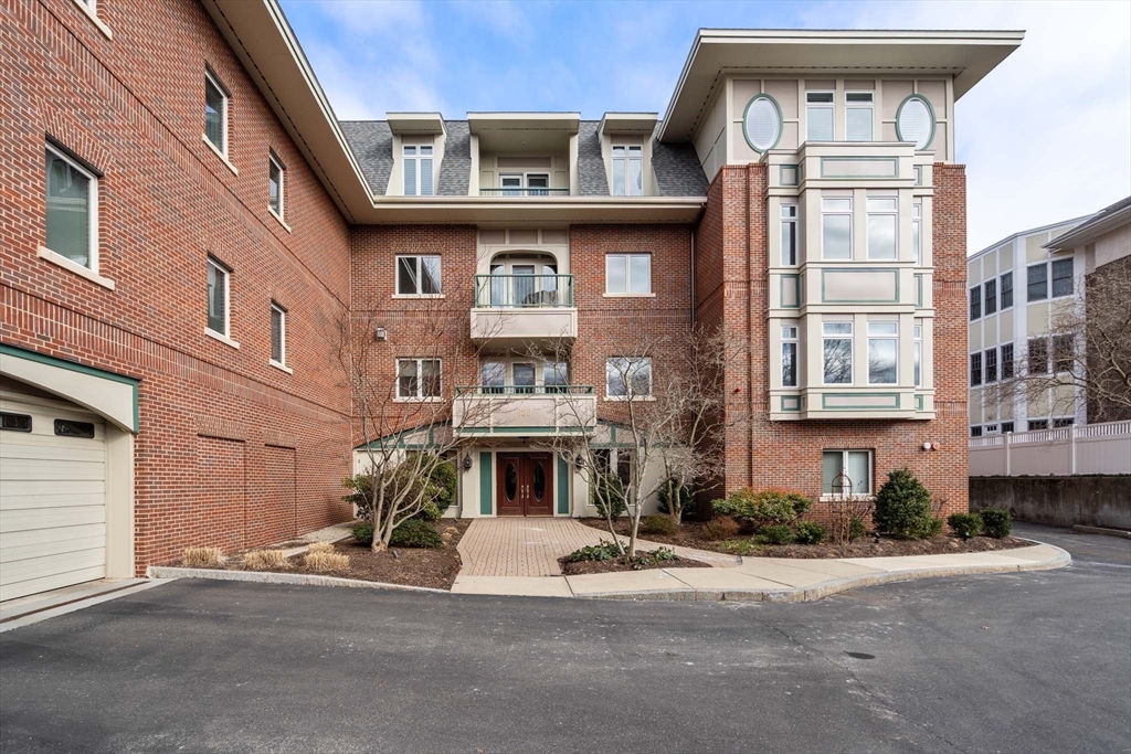 630 Hammond Street, Unit 102 Brookline, MA 02467 - Photo 2 of 19 a view of a building with a street