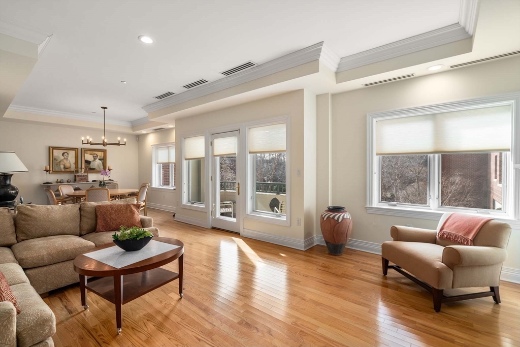 630 Hammond Street, Unit 102 Brookline, MA 02467 - Photo 4 of 19 a living room with furniture and a large window