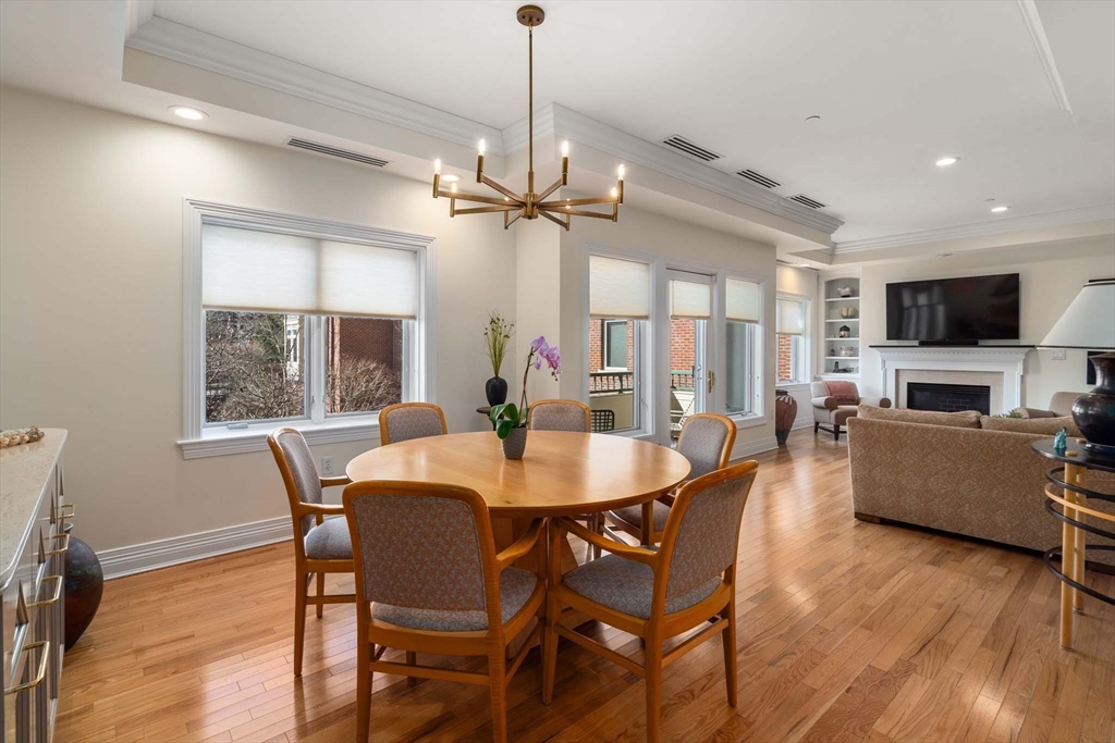 630 Hammond Street, Unit 102 Brookline, MA 02467 - Photo 8 of 19 a view of a dining room with furniture window and wooden floor
