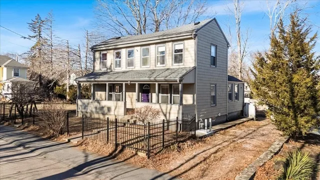 a view of house with yard