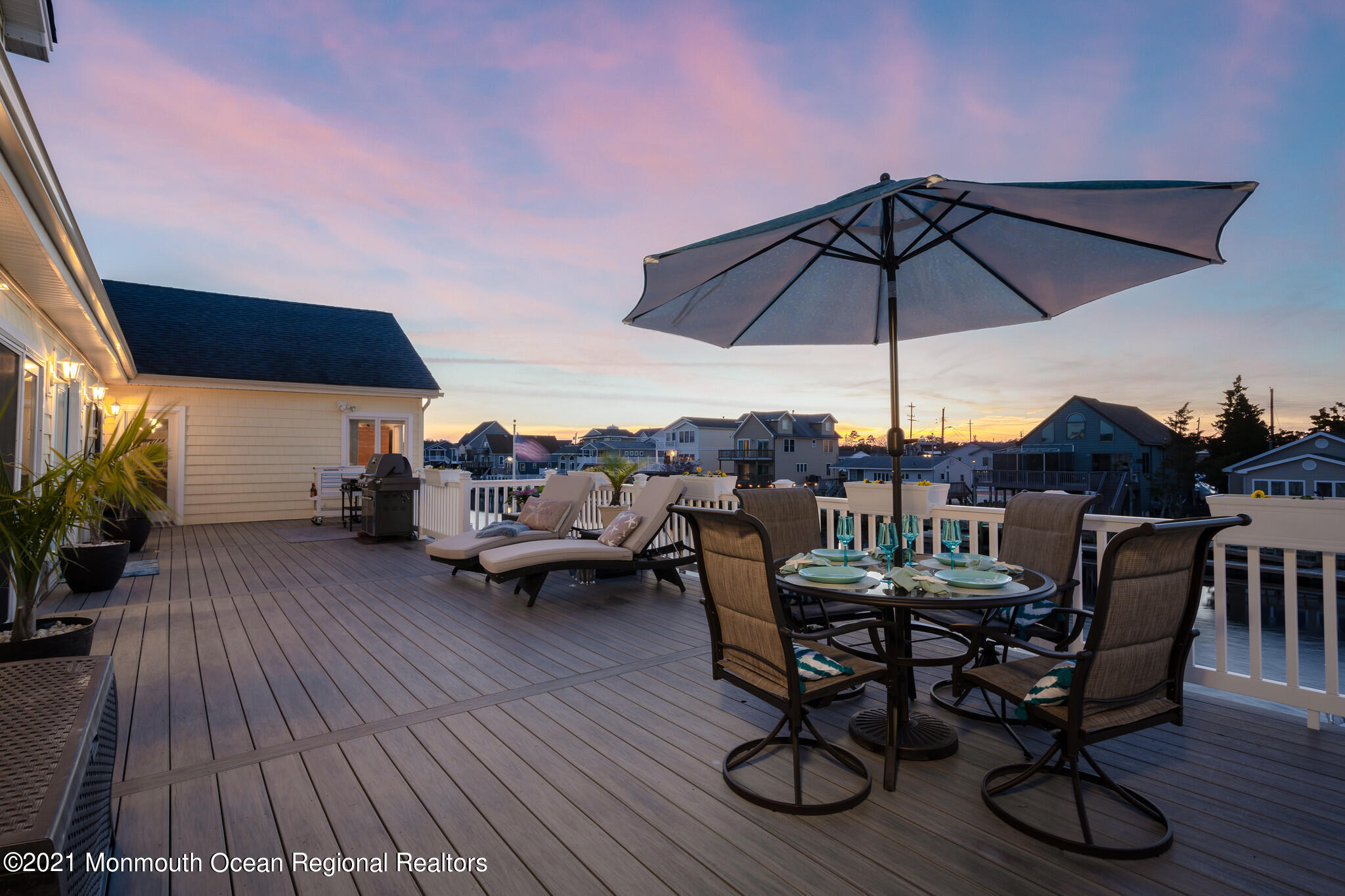 97 Dolphin Road Tuckerton, NJ 08087 - Photo 14 of 53 a view of a terrace with furniture and umbrella