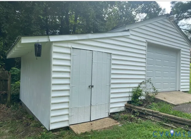 a view of backyard with cabin