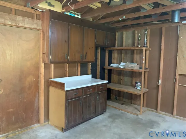 a kitchen with a stove and a refrigerator