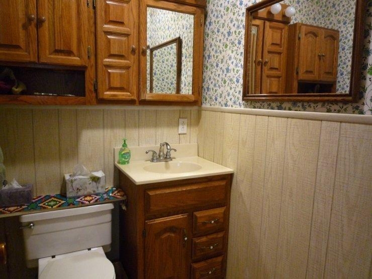 9309 Kleinman Road Highland, IN 46322 - Photo 6 of 10 a bathroom with a toilet sink and mirror