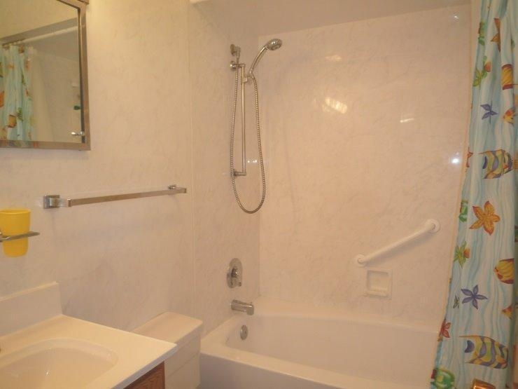9309 Kleinman Road Highland, IN 46322 - Photo 9 of 10 a bathroom with a bath tub with a shower