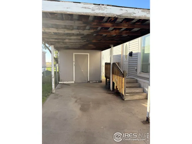 a view of a hallway with stairs