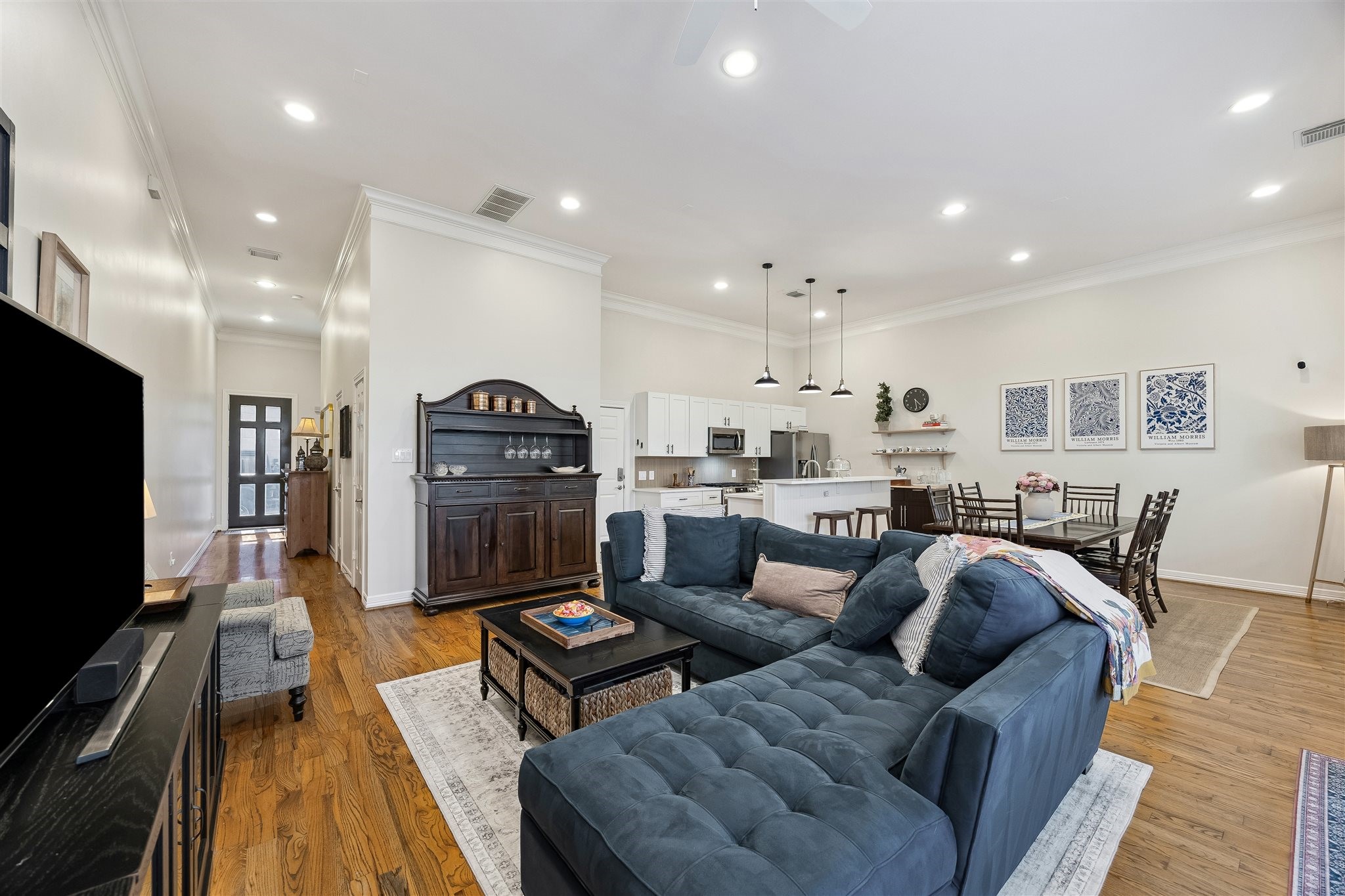 Come discover everything this home has to offer!  First floor living with beautiful hardwoods, open plan for flexibility, overlooking the private, fenced backyard.