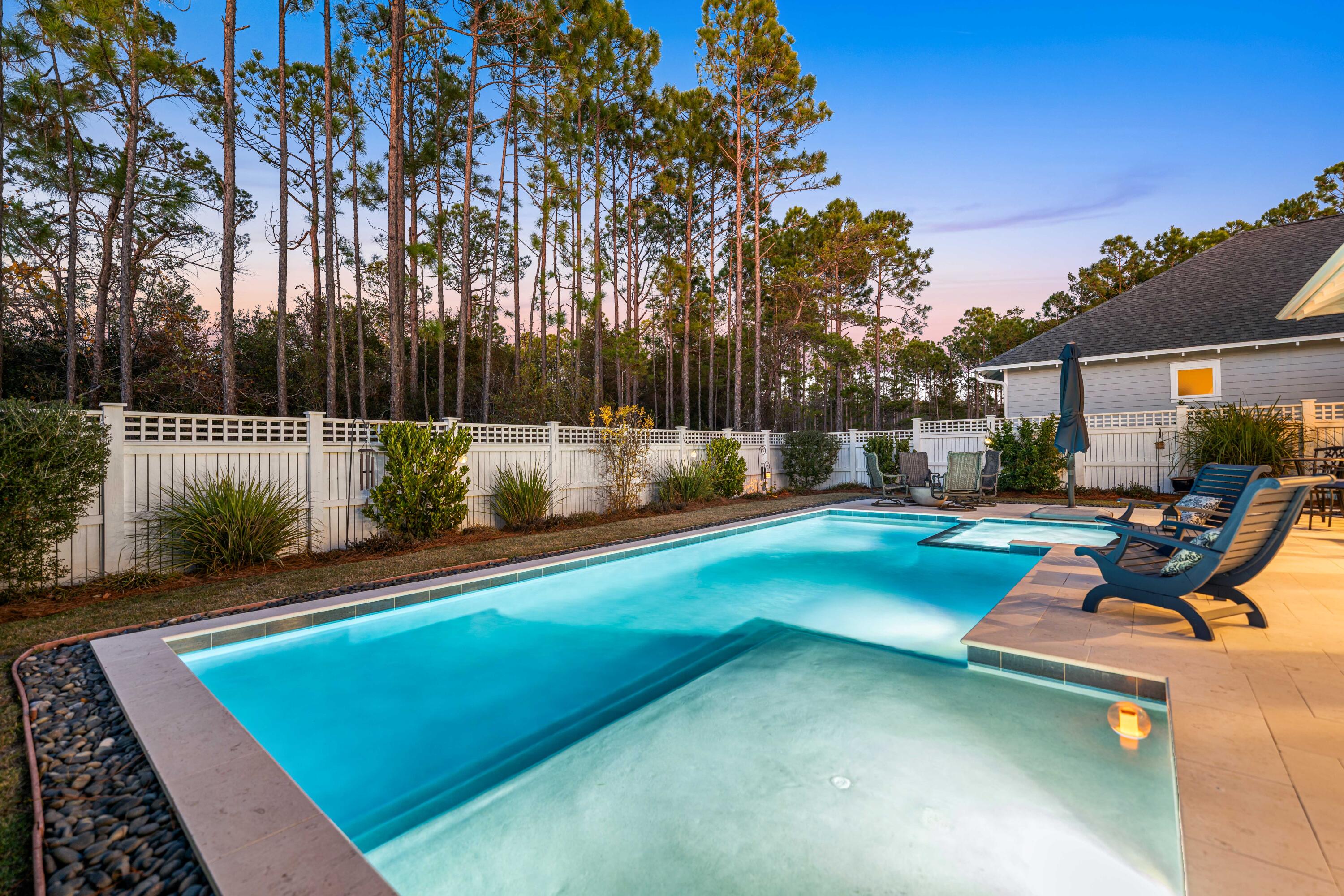 41 East Firethorn Cir Inlet Beach Inlet Beach, FL 32461 - Photo 19 of 66 a view of a backyard with swimming pool and sitting area
