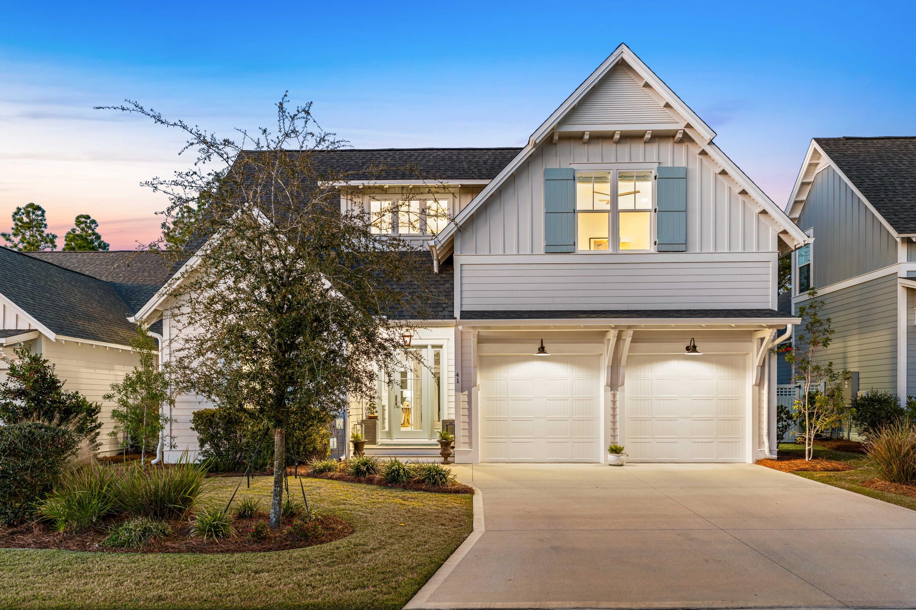 41 East Firethorn Cir Inlet Beach Inlet Beach, FL 32461 - Photo 3 of 66 a front view of a house with a yard and garage