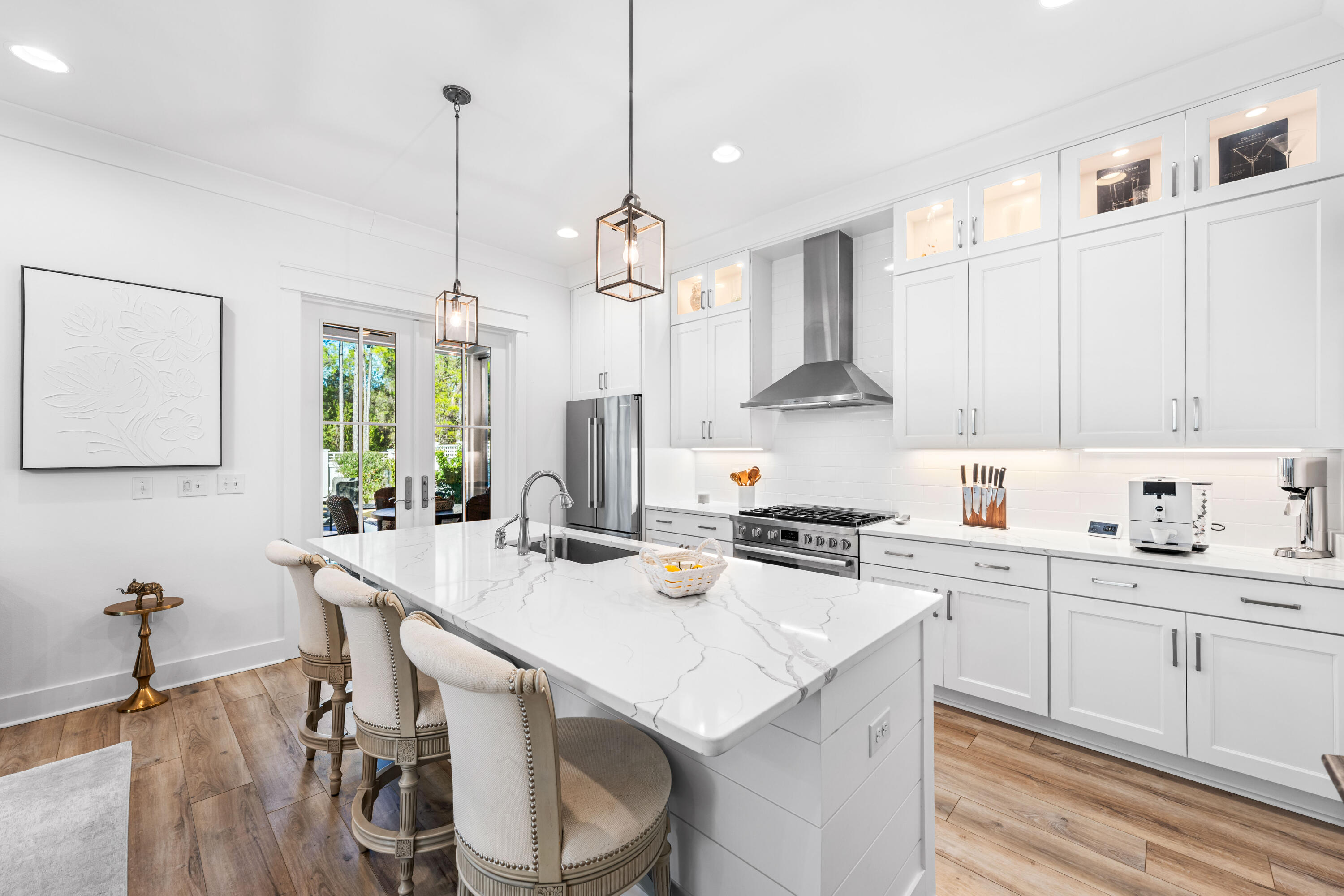 41 East Firethorn Cir Inlet Beach Inlet Beach, FL 32461 - Photo 34 of 66 a kitchen with a stove a sink a center island and wooden floor