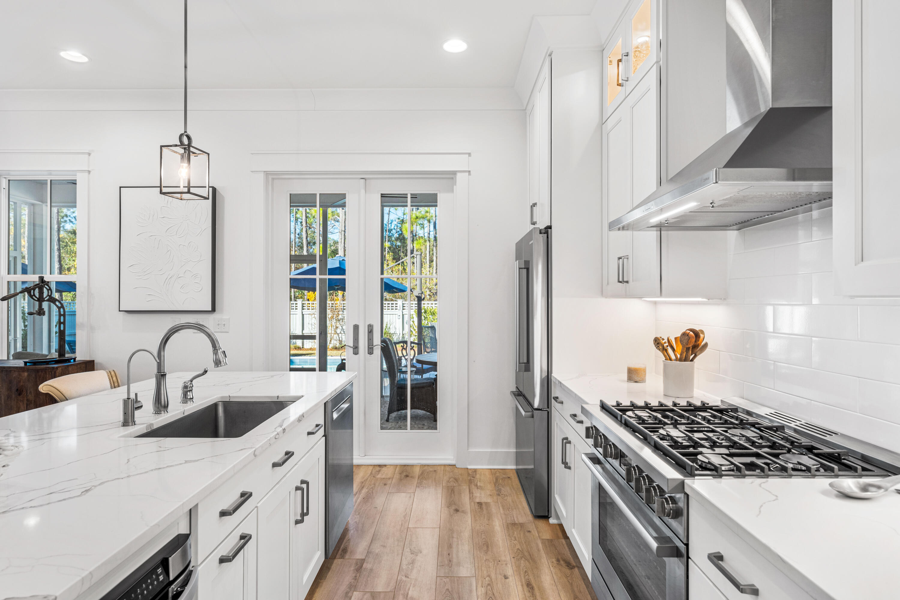 41 East Firethorn Cir Inlet Beach Inlet Beach, FL 32461 - Photo 35 of 66 a kitchen with granite countertop a sink stainless steel appliances and cabinets