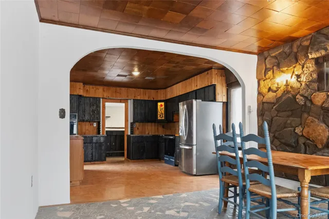 a view of kitchen and dining room with furniture