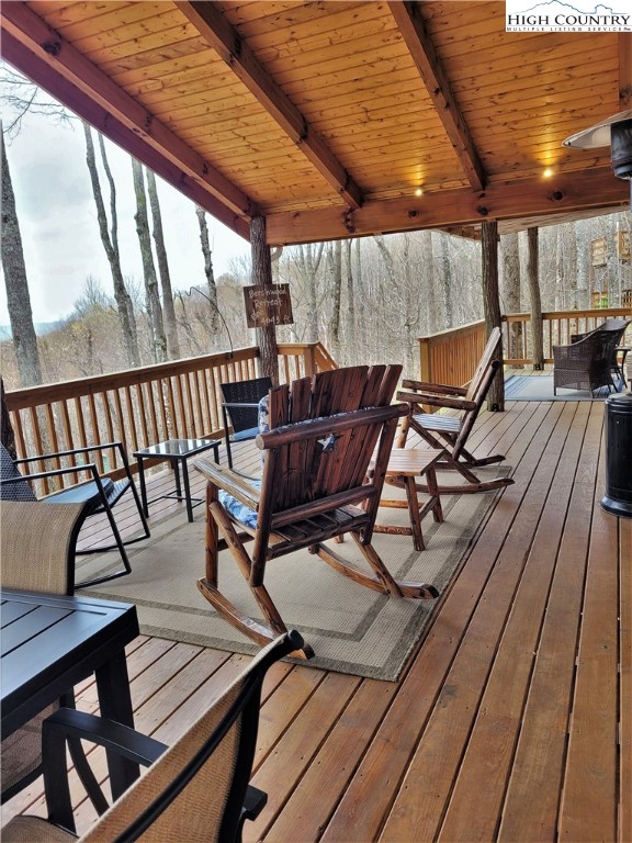 143 Tamarack Road Beech Mountain, NC 28604 - Photo 12 of 47 a view of a chairs and table on the balcony