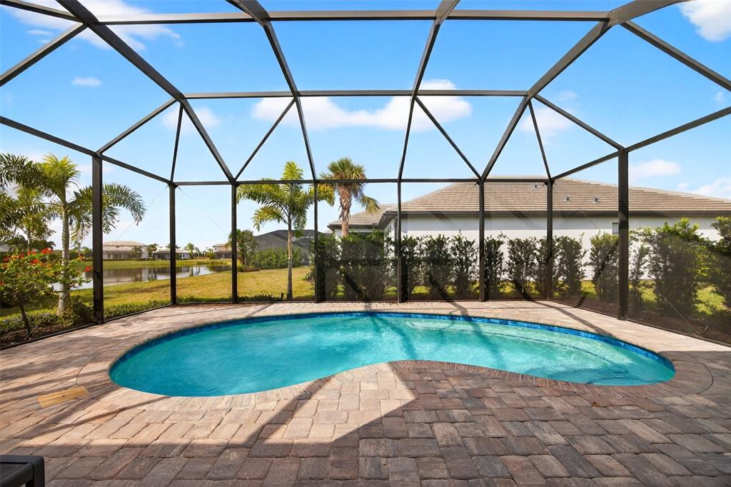 17744 Savory Mist Circle Lakewood Ranch, FL 34211 - Photo 16 of 55 a view of a swimming pool with a yard