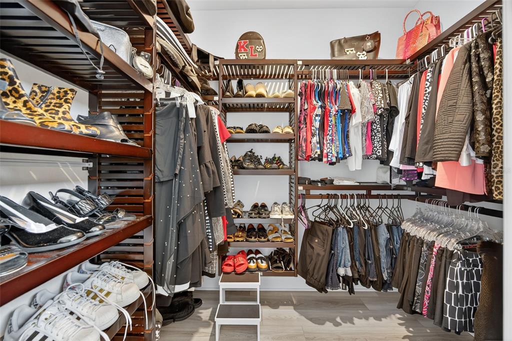 17744 Savory Mist Circle Lakewood Ranch, FL 34211 - Photo 22 of 55 a view of walk in closet with clothes