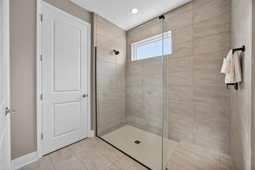 17744 Savory Mist Circle Lakewood Ranch, FL 34211 - Photo 23 of 55 a bathroom with a shower