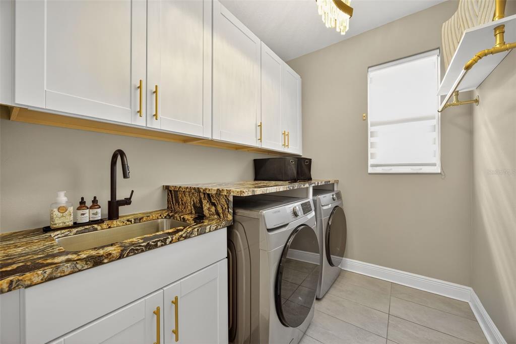 17744 Savory Mist Circle Lakewood Ranch, FL 34211 - Photo 29 of 55 a utility room with sink dryer and washer