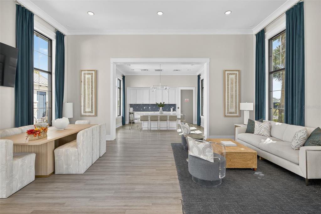 17744 Savory Mist Circle Lakewood Ranch, FL 34211 - Photo 33 of 55 a living room with furniture and large windows