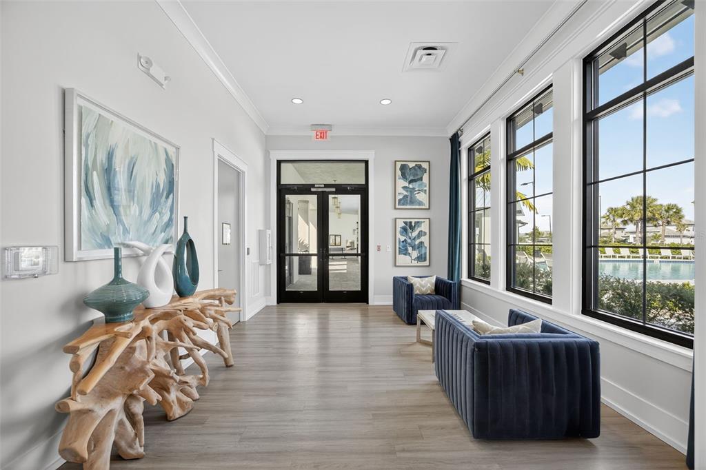 17744 Savory Mist Circle Lakewood Ranch, FL 34211 - Photo 35 of 55 a living room with furniture and large windows