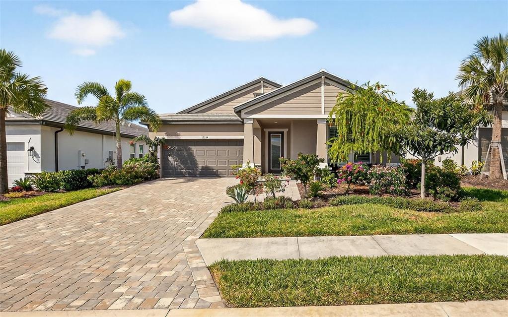 17744 Savory Mist Circle Lakewood Ranch, FL 34211 - Photo 44 of 55 a front view of house with yard and green space