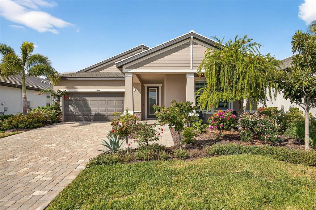 17744 Savory Mist Circle Lakewood Ranch, FL 34211 - Photo 45 of 55 a front view of a house with a yard