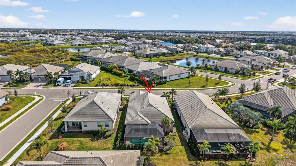 17744 Savory Mist Circle Lakewood Ranch, FL 34211 - Photo 49 of 55 an aerial view of residential houses with outdoor space