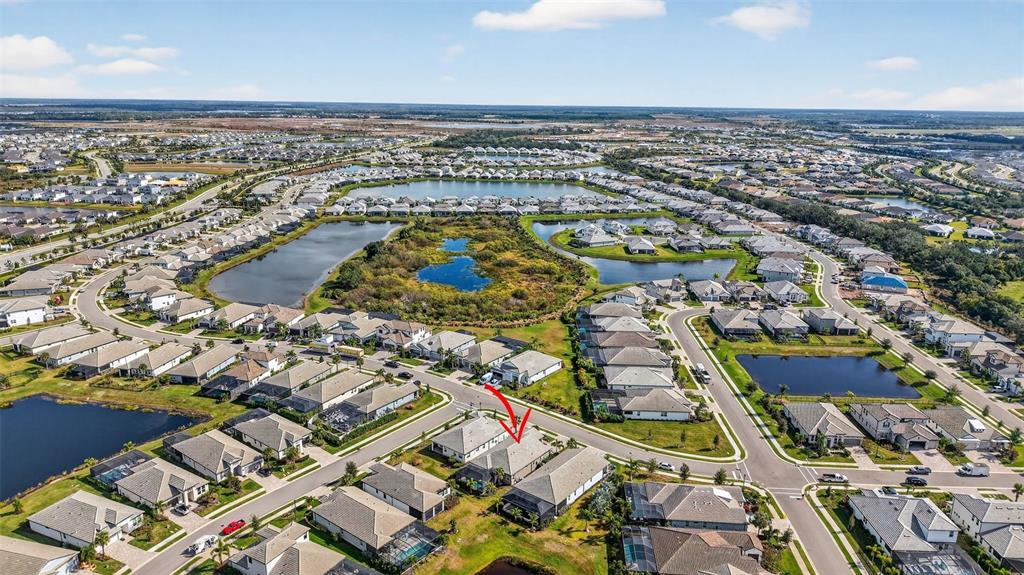 17744 Savory Mist Circle Lakewood Ranch, FL 34211 - Photo 50 of 55 an aerial view of a residential building with parking space