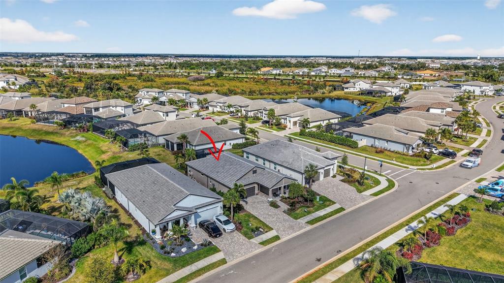 17744 Savory Mist Circle Lakewood Ranch, FL 34211 - Photo 52 of 55 an aerial view of residential houses with outdoor space