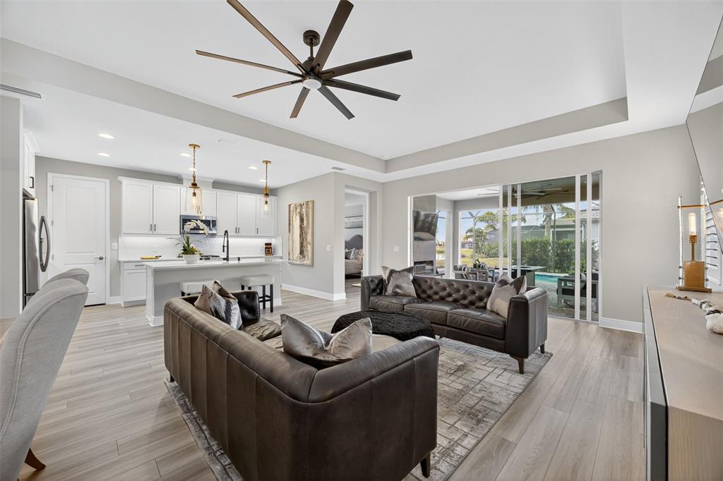 17744 Savory Mist Circle Lakewood Ranch, FL 34211 - Photo 10 of 55 a living room with furniture and a large window