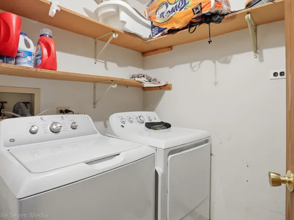 a utility room with dryer and washer
