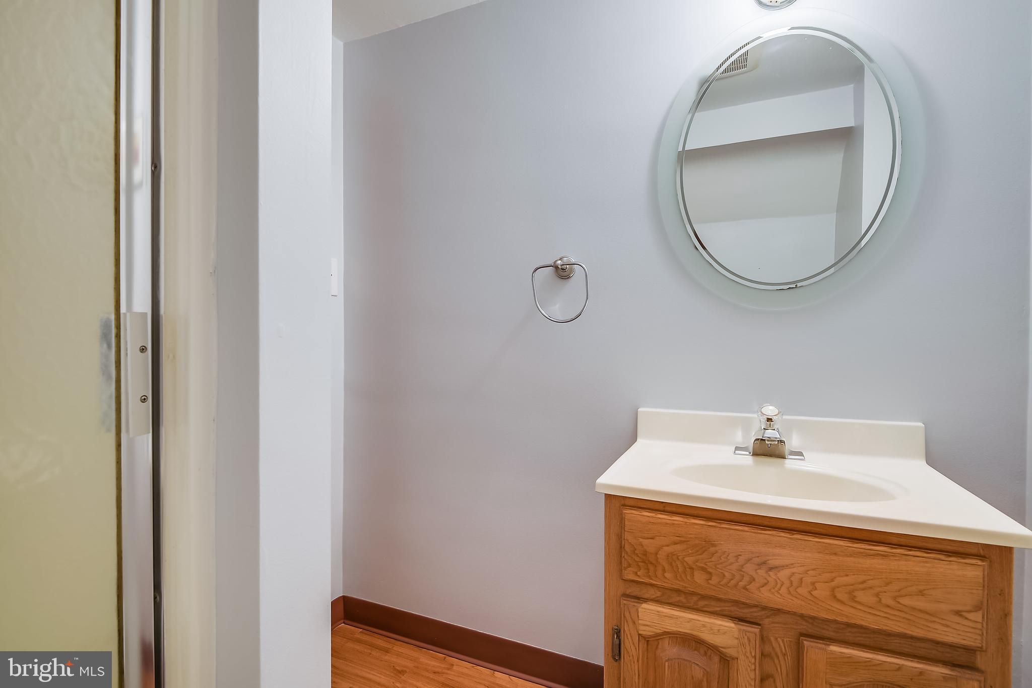 1622 Myamby Road Baltimore, MD 21286 - Photo 22 of 28 a bathroom with a sink and a mirror