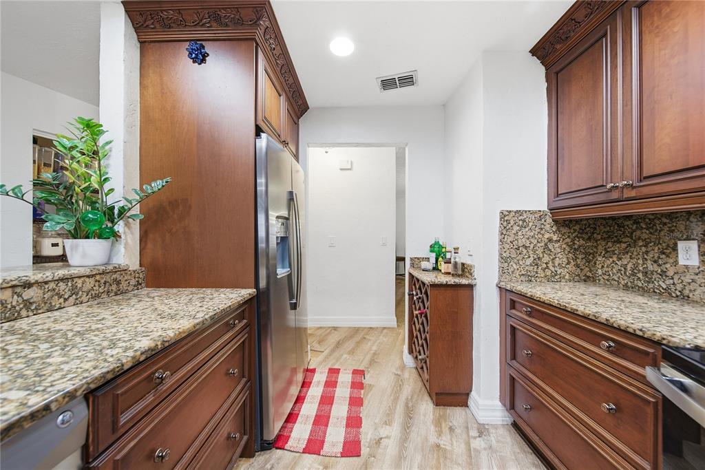 4602 Buckeye Road Tampa, FL 33624 - Photo 15 of 36 a kitchen with sink and refrigerator
