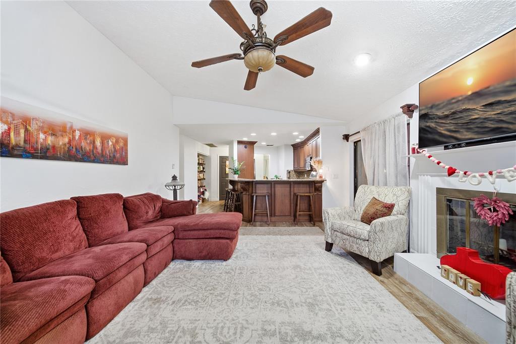 4602 Buckeye Road Tampa, FL 33624 - Photo 20 of 36 a living room with furniture and a flat screen tv