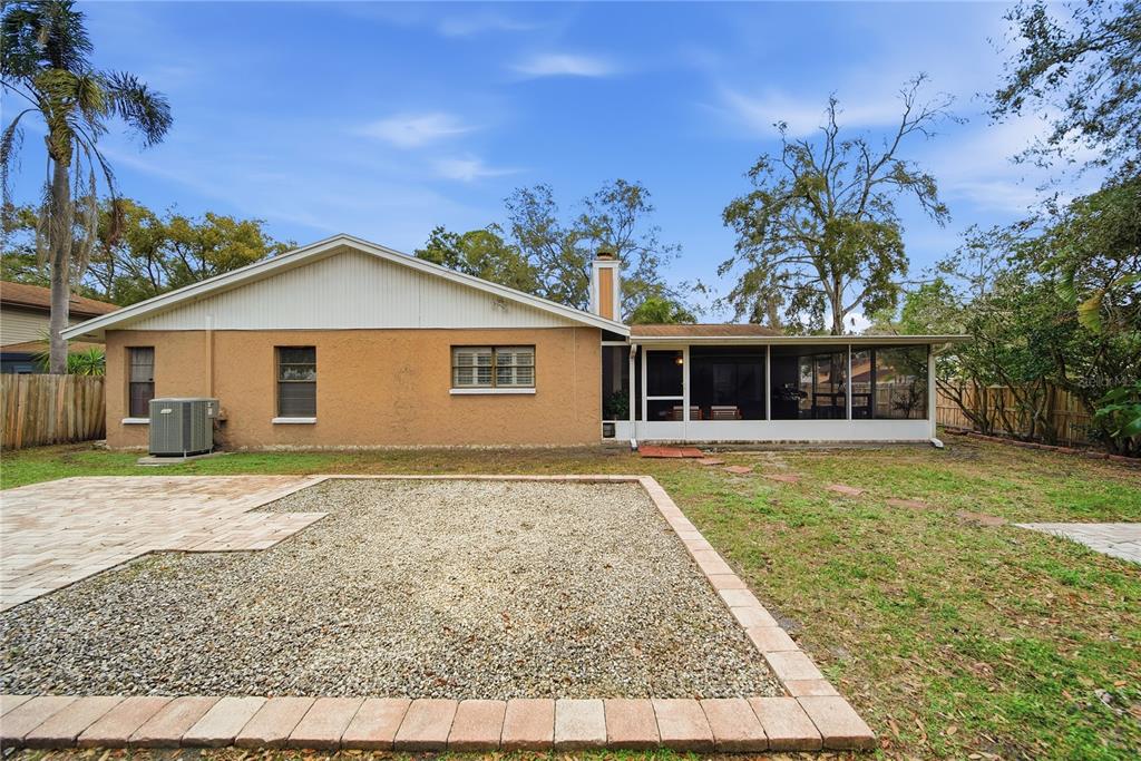 4602 Buckeye Road Tampa, FL 33624 - Photo 26 of 36 a front view of a house with a garden
