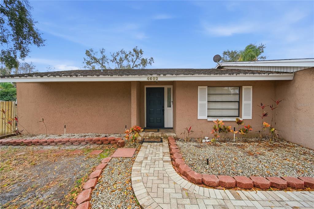 4602 Buckeye Road Tampa, FL 33624 - Photo 5 of 36 a view of a house with a patio
